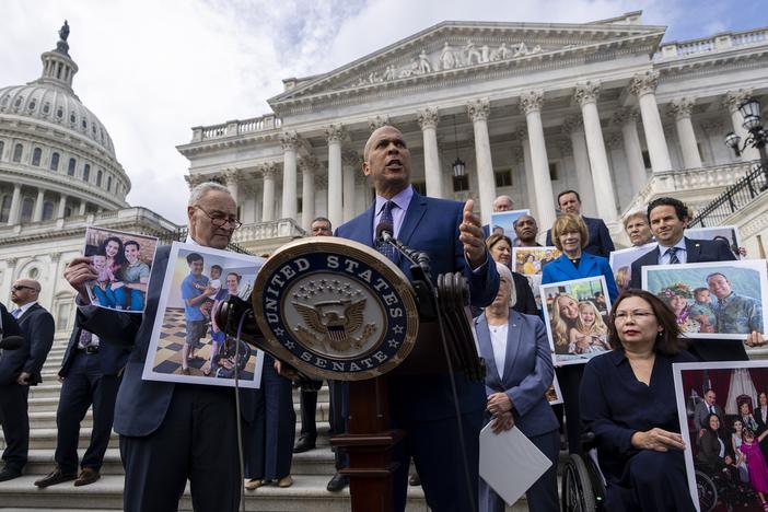 Sen. Cory Booker, D-NJ., accompanied by Senate Majority Leader Chuck Schumer, D-NY, left, and Sen. Tammy Duckworth, D-Ill., right, speaks about the need to protect rights to in vitro fertilization (IVF), before Senate vote on the issue.