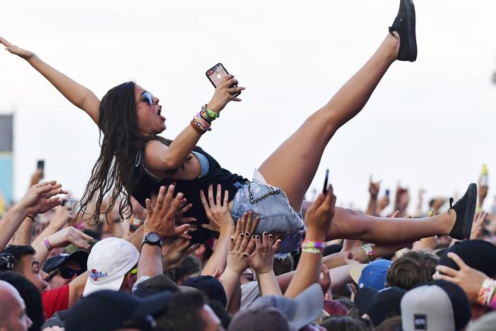 A crowd surfer celebrates Taking Back Sunday’s performance during the second and final day of the Warped Tour music festival in Atlantic City, N.J., on June 30, 2019.