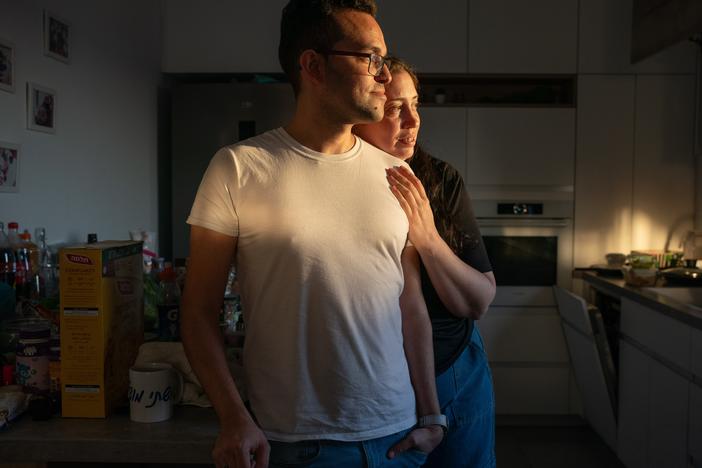 Shlomy Green, 37, and wife Inbal Green, 40, pack their home in Rishon Letsiyon, Israel, on July 11. The couple decided to leave Israel with their four-year-old daughter Riley and move to Thailand.