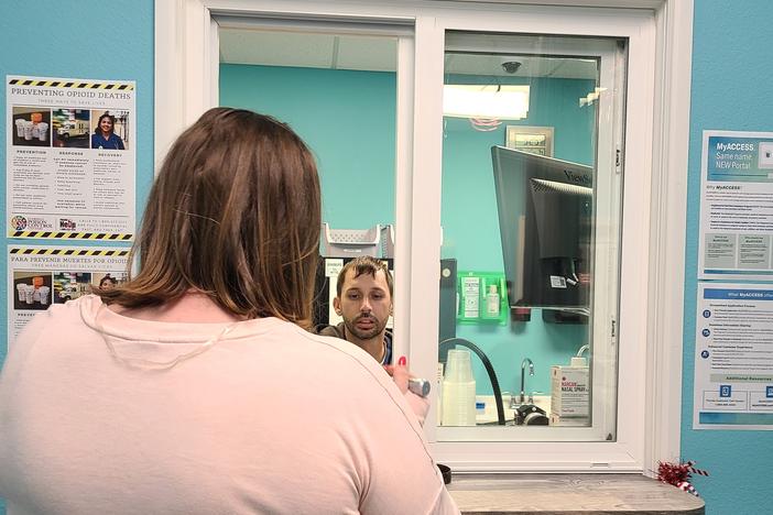 Stephanie, who asked that only her first name be used, picks up her methadone prescription at the Operation PAR clinic in Inverness, Florida. 