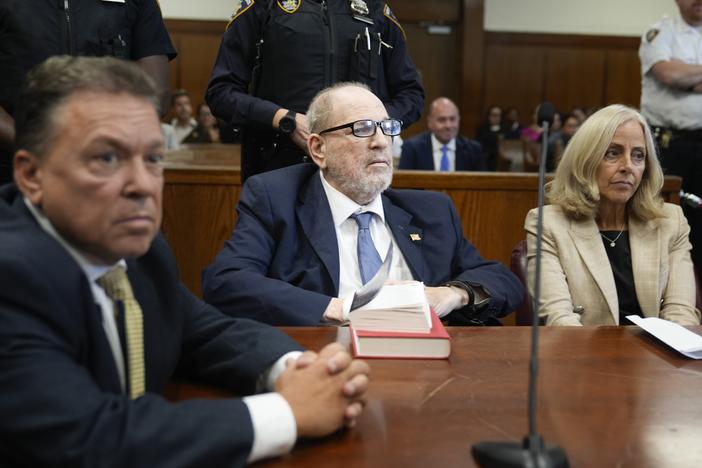 Harvey Weinstein (center) appears in criminal court in New York on Wednesday.