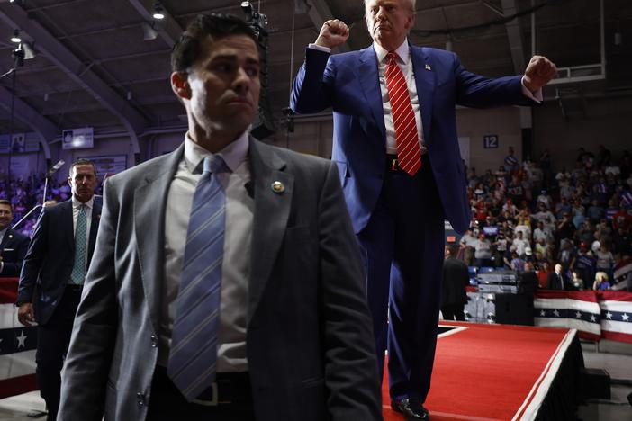 Surrounded by U.S. Secret Service agents, the Republican presidential nominee, former President Donald Trump, dances his way offstage.