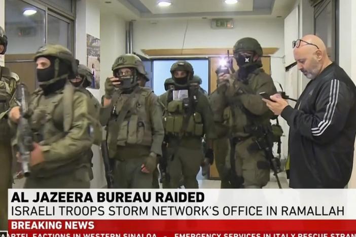 This image made from video provided by Al Jazeera English shows Israeli troops raiding their bureau in Ramallah, West Bank, Sunday, Sept. 22, 2024.