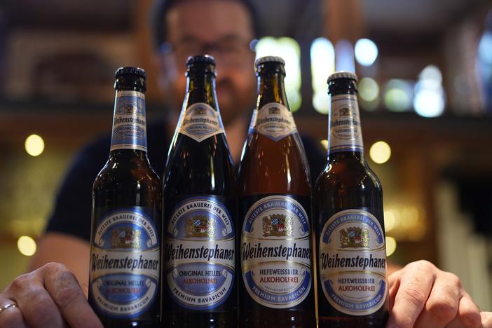 Head Brewmaster Tobias Zollo poses behind non alcoholic beer at the Weihenstephan brewery in Freising, Germany, Friday, Sept. 20, 2024.