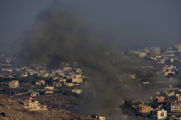 Smoke rises from an Israeli airstrike on Kfar Rouman village, as seen from Marjayoun town, south Lebanon, on Monday.