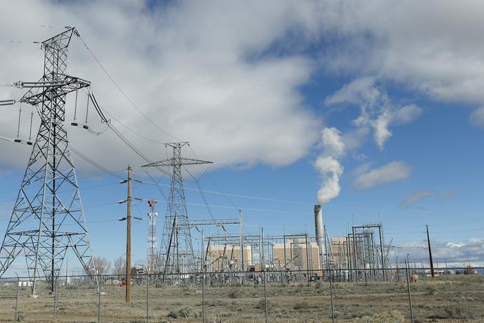 Power lines lead into the coal-fired Intermountain Power Plant outside Delta, Utah. The plant, which is getting new turbines that can burn natural gas and hydrogen, is at the center of an ambitious project to cut greenhouse gas emissions.