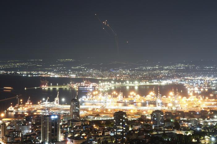 Israeli Iron Dome air defense system fires to intercept rockets that were launched from Lebanon, in northern Israel, on Tuesday.