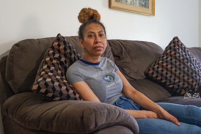 Debra Ragoonanan, a nursing assistant, says she has endured PTSD after COVID killed dozens in 2020 at the Massachusetts veterans facility where she still works. The state agreed to a $56 million settlement for veterans and their families, but caretakers have gotten little assistance. 