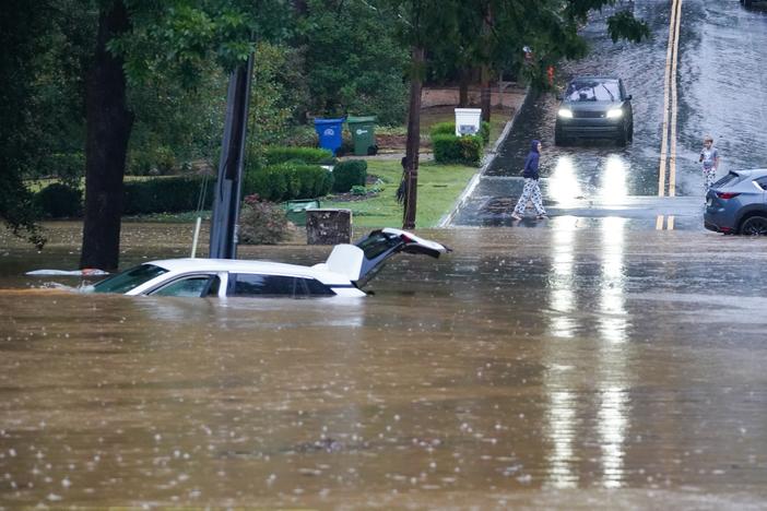 The streets are flooded near Peachtree Creek after hurricane Helene brought in heavy rains over night on September 27, 2024 in Atlanta, Georgia.