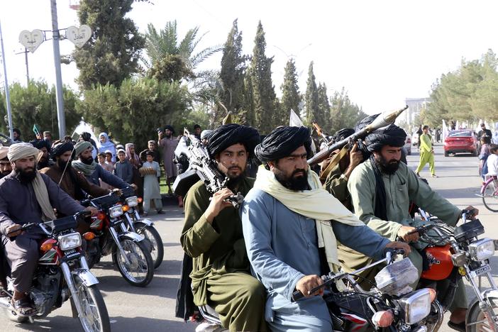 Taliban fighters celebrate the third anniversary of the withdrawal of US-led troops from Afghanistan on Aug. 14, 2024.
