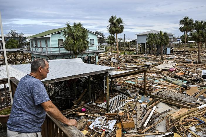 David Hester inspects damages of his house on Saturday after Hurricane Helene made landfall in Horseshoe Beach, Fla.