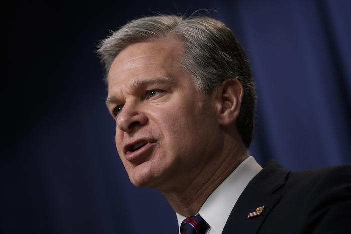 FBI Director Christopher Wray speaks during a news conference in 2023.