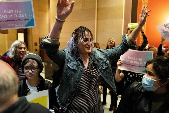 Rep. Leigh Finke, Minnesota's first openly trans legislator, arrives to cheers from supporters just before before the Minnesota Senate introduced the trans refuge bill at the state capitol building in Saint Paul in April 2023. Transgender rights may come up in the vice presidential debate on Tuesday.