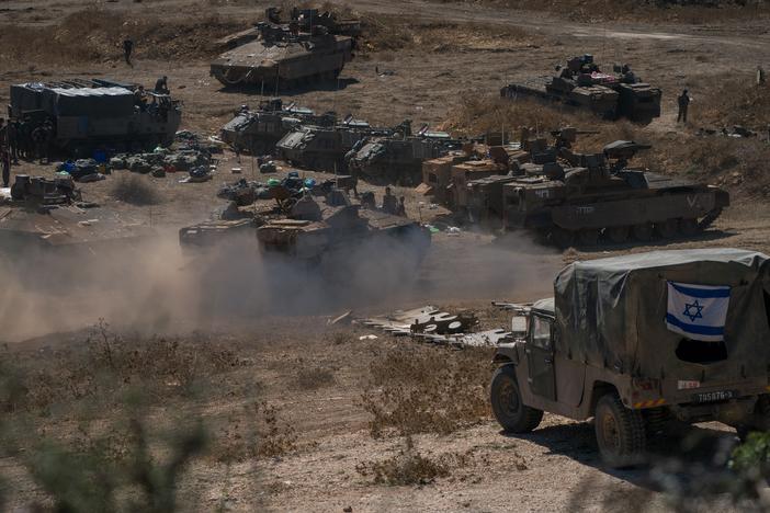 Tanks and troops gather in northern Israel on Monday in preparation for a ground invasion.