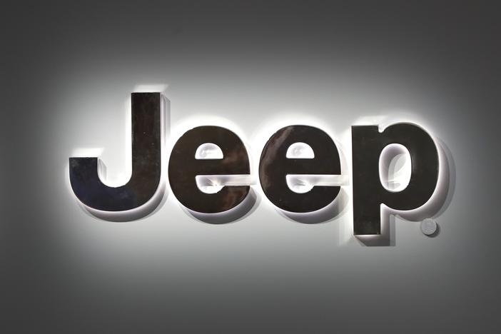 A Jeep logo is displayed at the North American International Auto Show in Detroit on Jan. 14, 2019. Jeep is recalling more than 194,000 plug-in hybrid SUVs worldwide because they can catch fire with the ignition turned off.