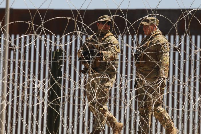 Members of the U.S. military patrol the banks of the Rio Grande as seen from Ciudad Juarez, Chihuahua state, Mexico on May 8, 2023.