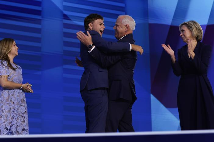 Tim Walz celebrates with his son Gus Walz at the Democratic National Convention.
