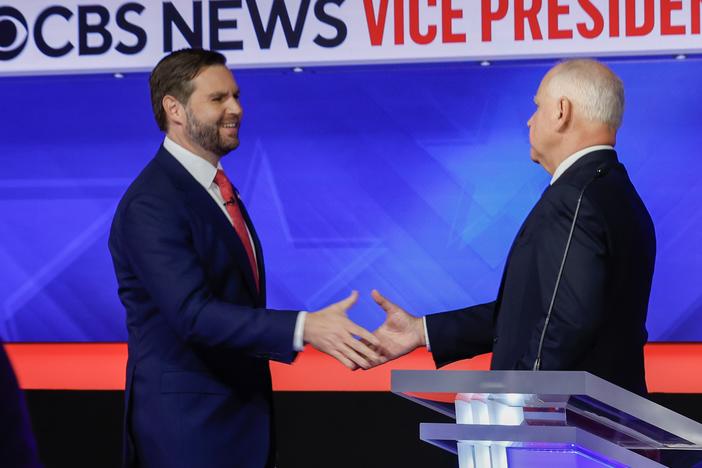 Minnesota Gov. Tim Walz and Ohio Sen. JD Vance shake hands after the vice presidential debate at the CBS Broadcast Center on Tuesday in New York City.