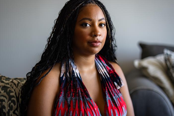 Chenedy Wiles, 27, poses for a portrait at her home on Wednesday in Chicago. Wiles took a 23andMe test over the summer and got her results in September. While she finds the data breach concerning, “so much of our data is already out there,” she said.