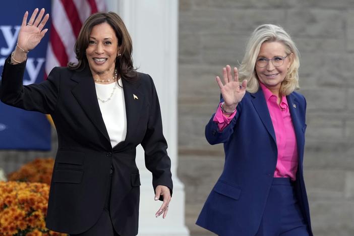 Vice President Harris walks with former Rep. Liz Cheney, R-Wyo., at a campaign rally in Ripon, Wis. on Oct. 3.