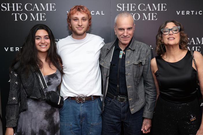 Ronan Day Lewis and his father, Daniel Day-Lewis (left to right in center) are teaming up for a feature film that will bring the decorated actor out of retirement. The pair are seen here as they attended a film screening last year.