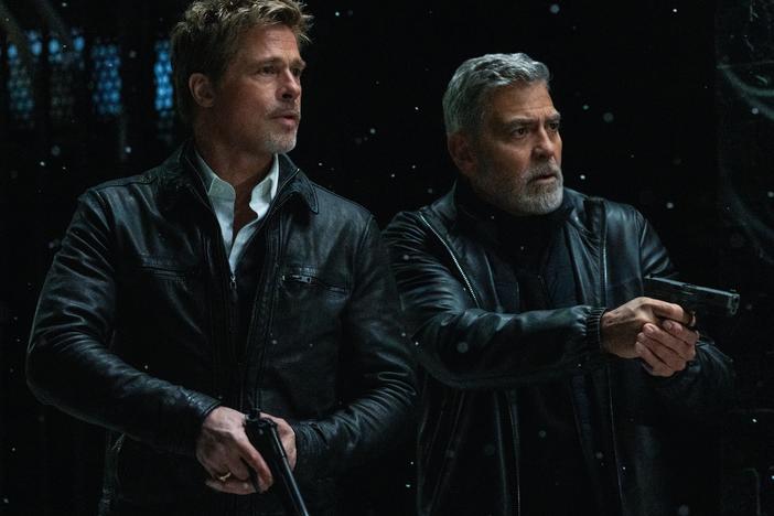 Brad Pitt and George Clooney play competing Hollywood "fixers" in the Apple TV+ film <em>Wolfs</em>.