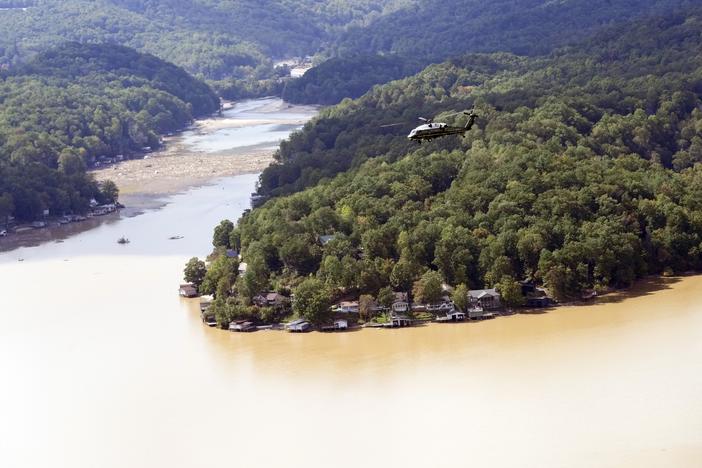 Marine One, with President Biden on board, flies over Lake Lure near Chimney Rock, N.C.,  southwest of the Baxter International plant closed by damage from Hurricane Helene.
