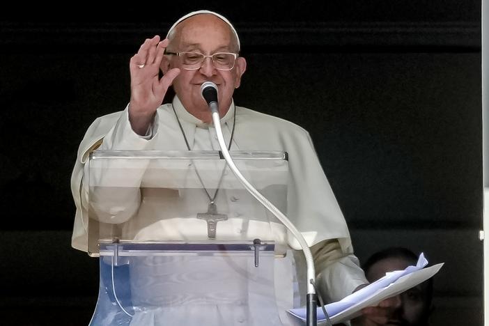 Pope Francis appears at his studio window for the traditional noon blessing of faithful and pilgrims gathered in St. Peter's Square at The Vatican, Sunday, Oct. 6, 2024.