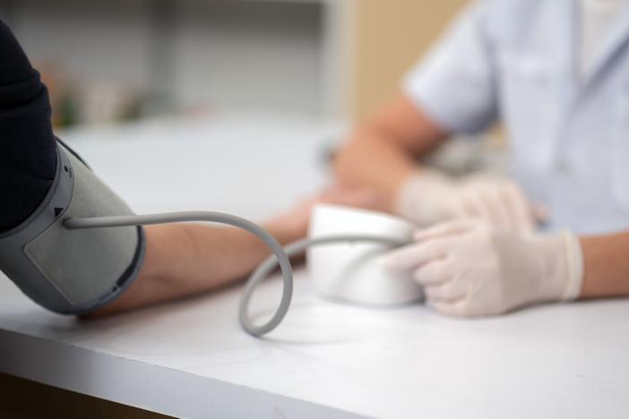 A patient's arm should be supported at around heart level when taking blood pressure readings.