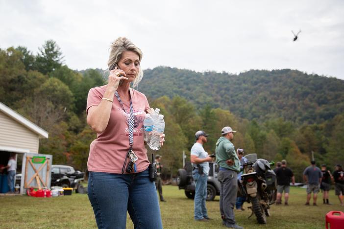 Misty Hughes, a fifth-generation resident of Poplar, N.C., organizes flood relief efforts at the Poplar Community Center on Friday. The mountain hamlet sits along the Nolichucky River, which rose to record levels of flooding from Tropical Storm Helene.