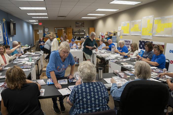 Volunteers for the Walworth County Democrats fold pamphlets for canvassers ahead of this year's presidential election.