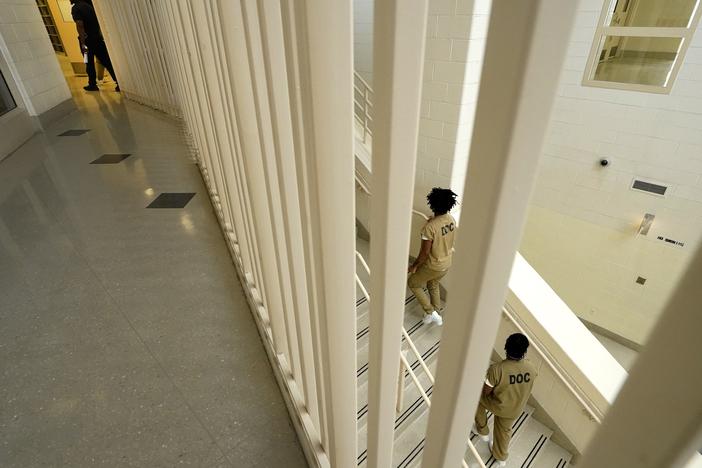 Inmates at the Cook County, Ill., jail head to a staging area at the jail's Division 11 law library before registering and voting in the local election in 2023 in Chicago.