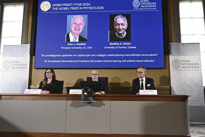 John Hopfield and Geoffrey Hinton, seen in picture, are awarded this year's Nobel Prize in Physics, which is announced at a press conference by Hans Ellergren, center, permanent secretary at the Swedish Academy of Sciences in Stockholm on Tuesday.