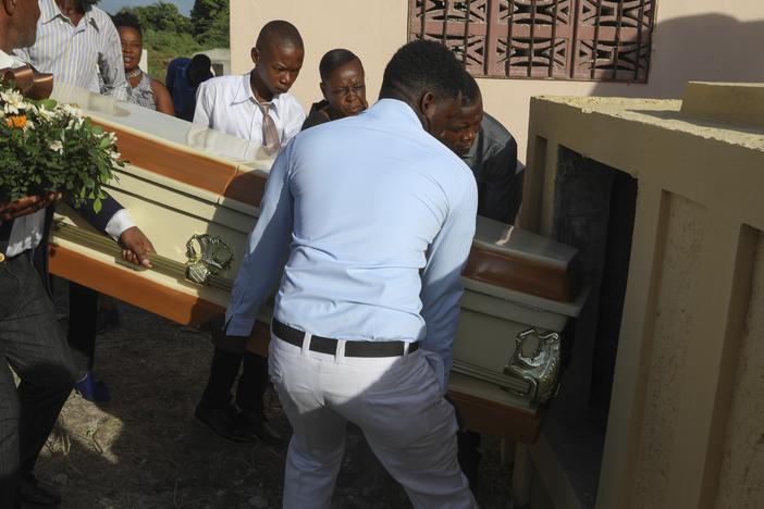 Relatives carry the coffin of Jean Louis Jeune Gracien, who was killed during an attack by armed gangs, at his funeral in Pont-Sonde, Haiti, on Tuesday.