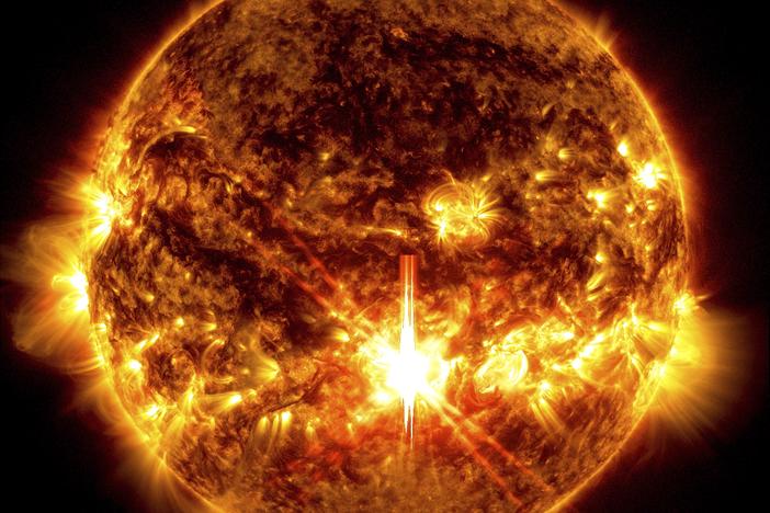 This photo provided by NASA, taken by the Solar Dynamics Observatory, shows a solar flare, the bright flash in the center of the image on Oct. 3, 2024.