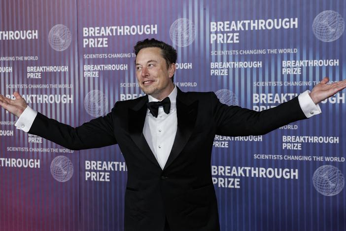Tesla CEO Elon Musk gestures at the Tenth Breakthrough Prize Ceremony at the Academy Museum of Motion Pictures in Los Angeles, California, on April 13, 2024. Tesla is hosting an event it's calling "We, Robot" in Hollywood on Thursday night.