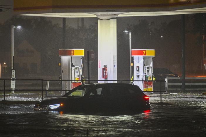 A vehicule is stranded on a water-flooded street after Hurricane Milton made landfall in Brandon, Florida on Oct. 9, 2024.
