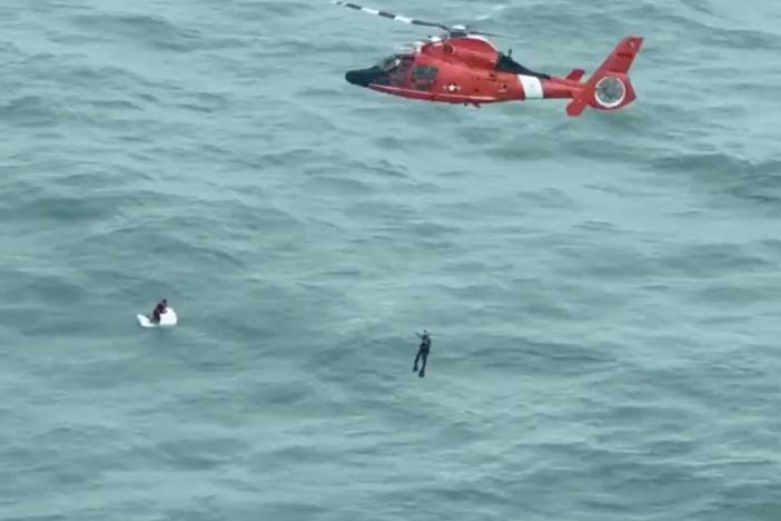 A man survived a harrowing ordeal in open water as Hurricane Milton passed nearby, spending the night clinging to a large cooler before being rescued by a Coast Guard helicopter crew some 30 miles from shore.