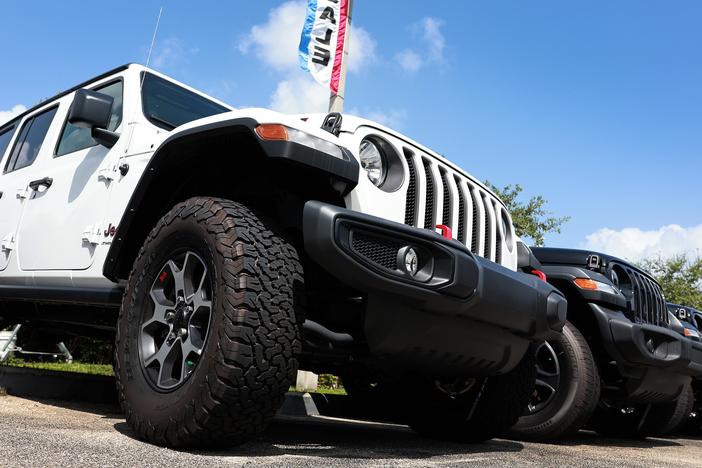 New Jeeps sit on a Dodge-Chrysler-Jeep-Ram dealership's lot on October 3, 2023, in Miami, Fla. Stellantis, which owns all four American brands, has been struggling financially.