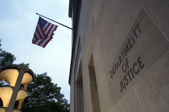 The Department of Justice is photographed on June 8, 2023. The department has brought a suit against Virginia election officials that accuses the state of striking names from voter rolls in violation of U.S. law.