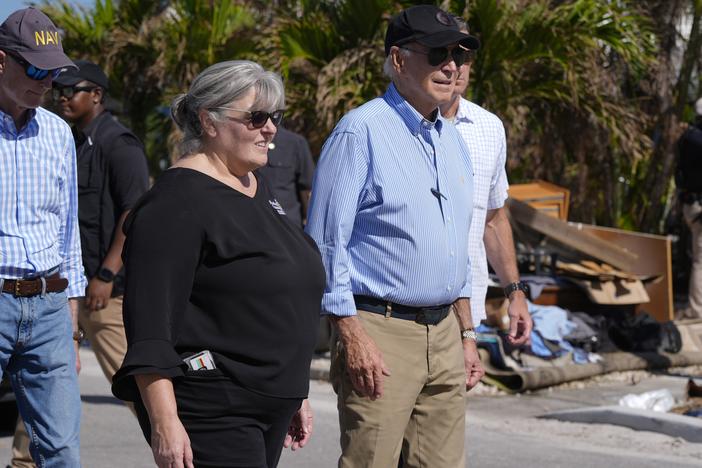 President Biden, right, walks during a tour of areas affected by Hurricane Milton in St. Pete Beach, Fla., following an aerial tour on Sunday.