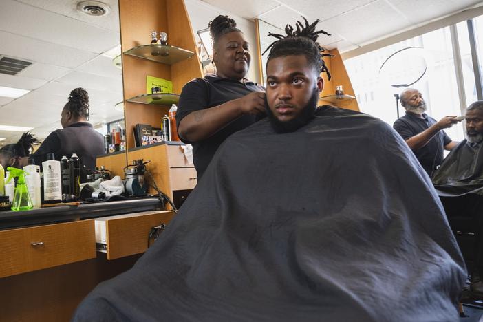 Cherita Evans aka Storm the Barber, with Christian Pounds in her chair at Head Changerz Barber Lounge in Rocky Mount, N.C. on May 23, 2024.
