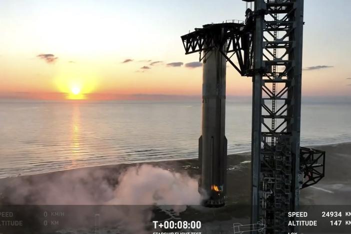 This image provided by SpaceX shows SpaceX's mega Starship rocket upon its return during a test flight on Sunday, over Boca Chica, Texas.