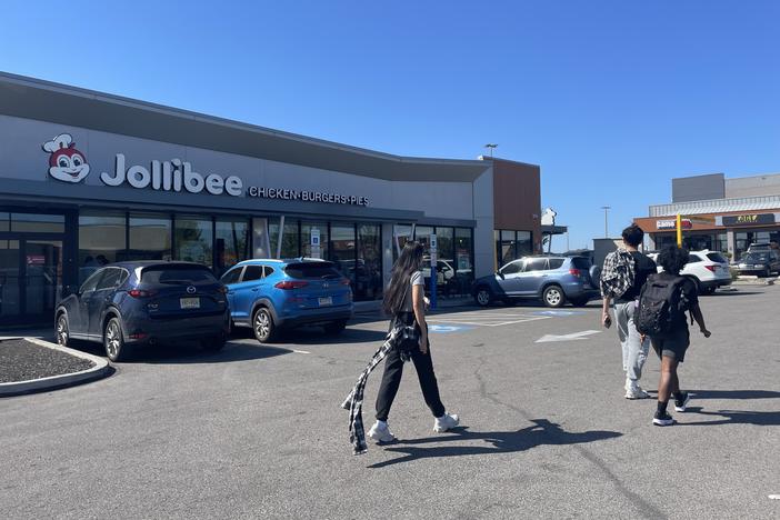 Canvassers with the Asian and Pacific Islander Political Alliance depart from the Jollibee parking lot in Philadelphia on Oct. 5. This Filipino fast food chain has expanded in the United States, reflecting the growing Asian American population.