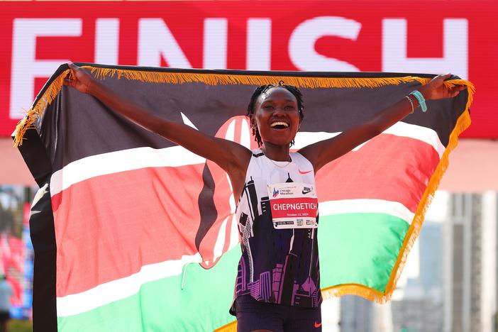 Ruth Chepngetich of Kenya celebrates after crossing the finish line to win the 2024 Chicago Marathon with a new world record time of 2:09:56 at Grant Park in Chicago on Sunday.