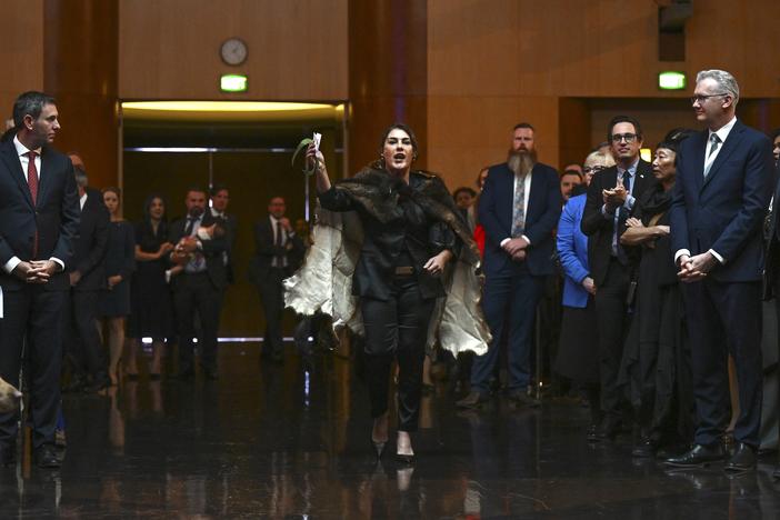 Australian Senator Lidia Thorpe, center, disrupts proceedings as Britain's King Charles III and Queen Camilla attend a Parliamentary reception hosted by Australian Prime Minister Anthony Albanese and partner Jodie Jaydon at Parliament House in Canberra, Australia, Monday, Oct. 21, 2024.