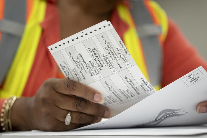 Absentee ballots are prepared to be mailed at the Wake County Board of Elections on Sept. 17 in Raleigh, N.C.