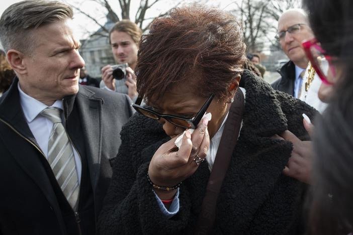 Pamela Walker, mother of Jayland Walker, who was shot and killed by police in Akron, Ohio, is comforted prior to appearing before reporters about police reform, on Capitol Hill in Washington, on Feb. 7, 2023.
