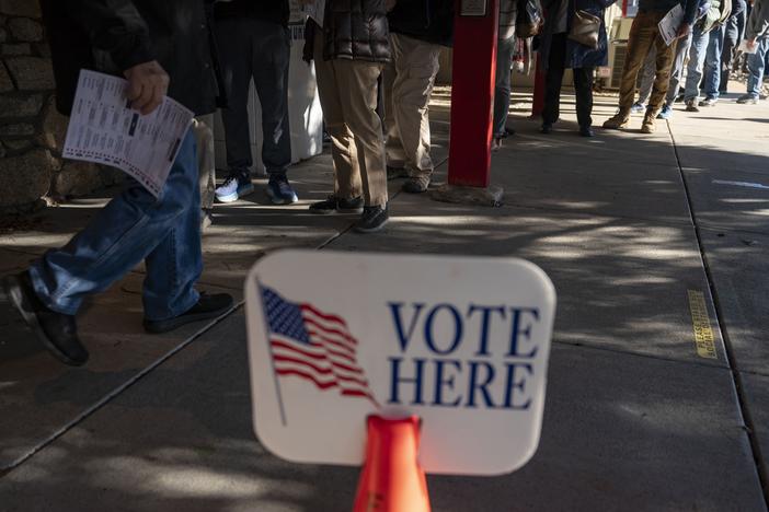 People wait in line to cast ballots during early voting at a polling station in Black Mountain, North Carolina, on Friday.