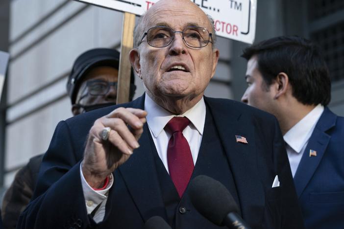 Rudy Giuliani speaks during a news conference outside federal court in Washington, Dec. 15, 2023.